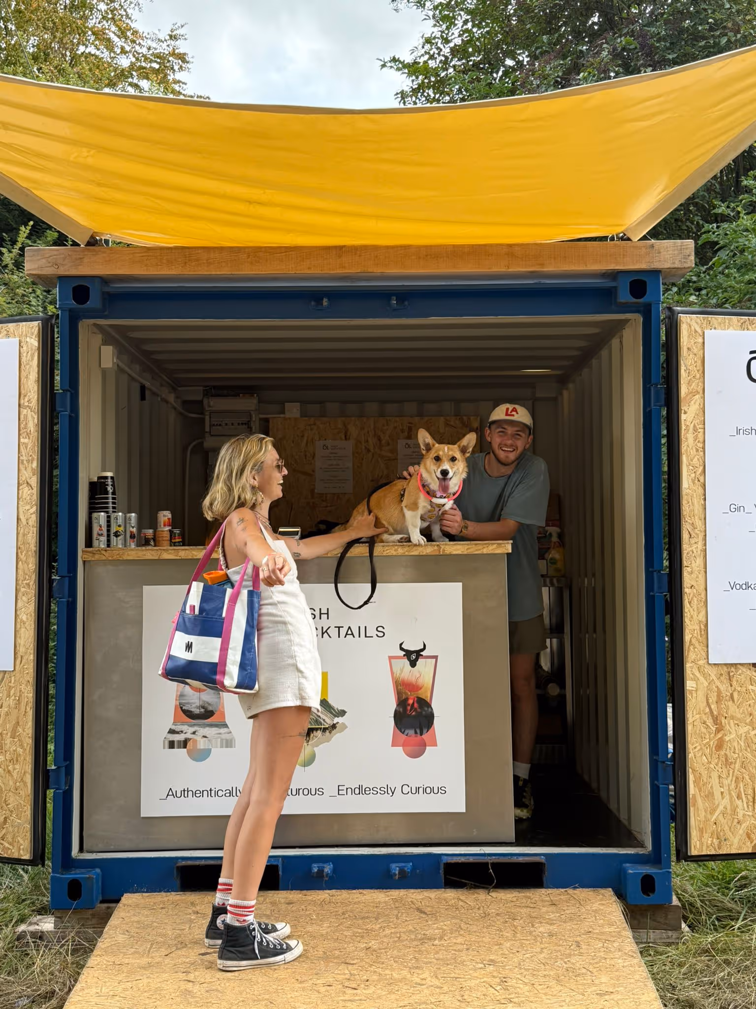 Woman and man standing at Ól Irish Cocktail stand